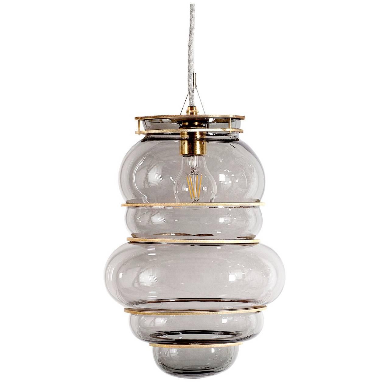 Contemporary Minor Flaws, Mouth Blown Glass Pendant with Brass Rings For Sale