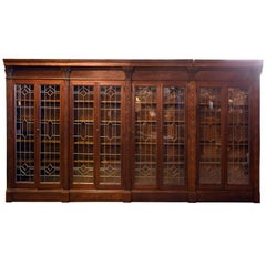 Ornately Carved Oak Bookcase with Leaded Glass Doors