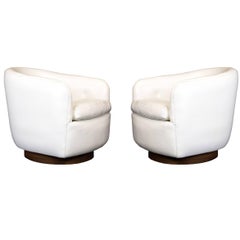 Pair of Milo Baughman White Vinyl Swivel Chairs