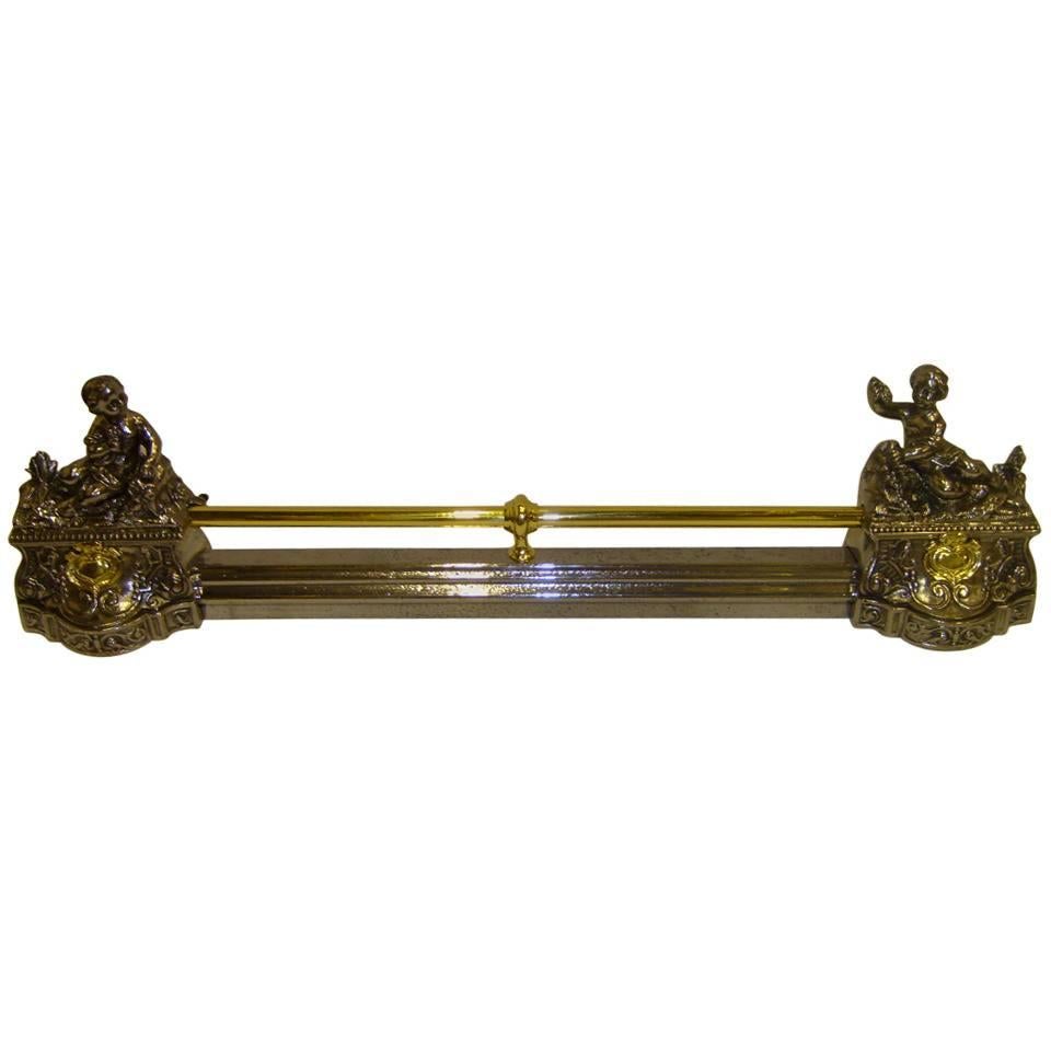 19th Century Iron and Brass Fire Bar Adorned with Cherubs For Sale