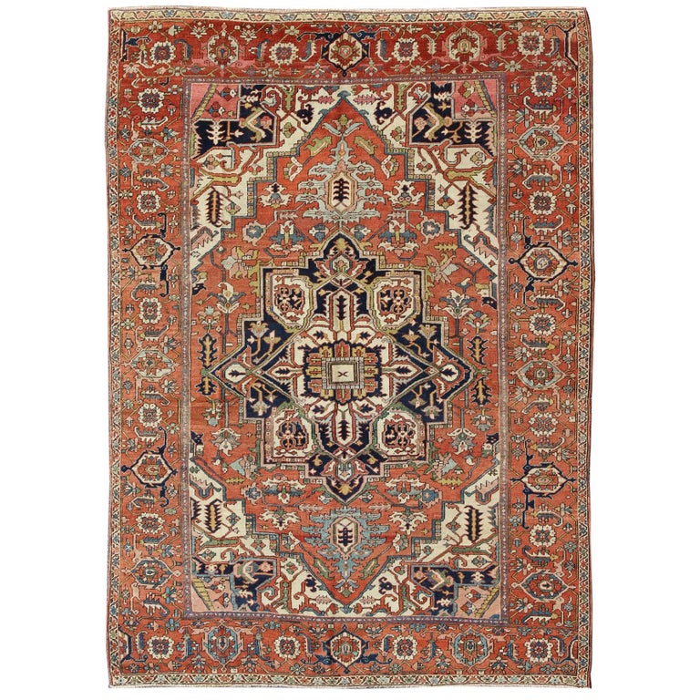 Antique Persian Serapi Rug with Bold Medallion in Orange, Navy Blue and