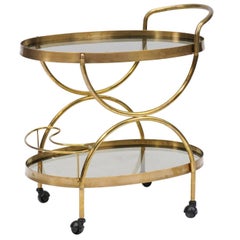 Florentine, 1950s, Two-Tiered Oval Brass and Glass Bar Cart with Curvy Lines