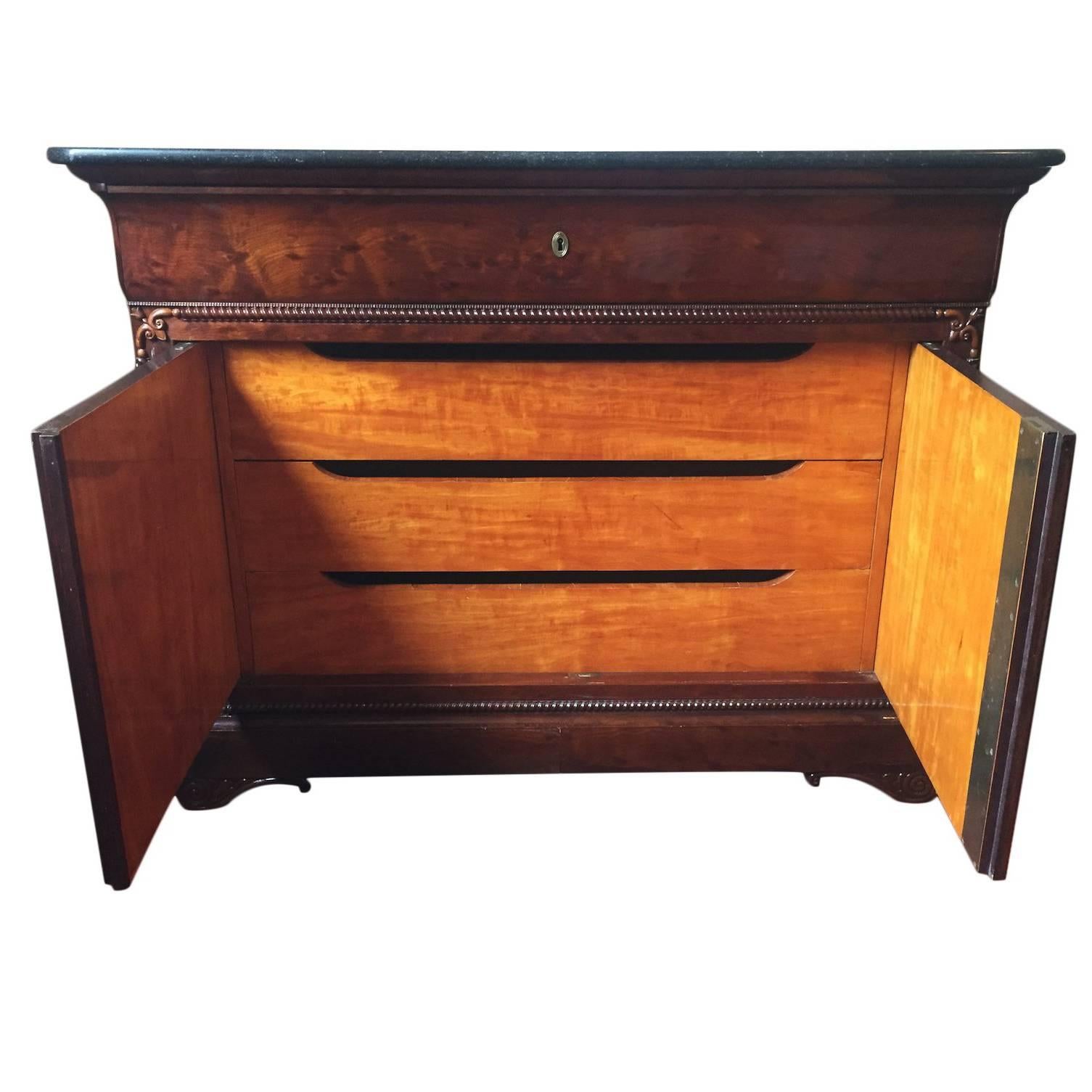 Splendid bird's-eye mahogany wood garniture on the front, the marble top is in very good condition.
The topmost drawer folding down into a secretary writing desk with compartment for storage and organization.
Elegant maple interior drawers.
      
