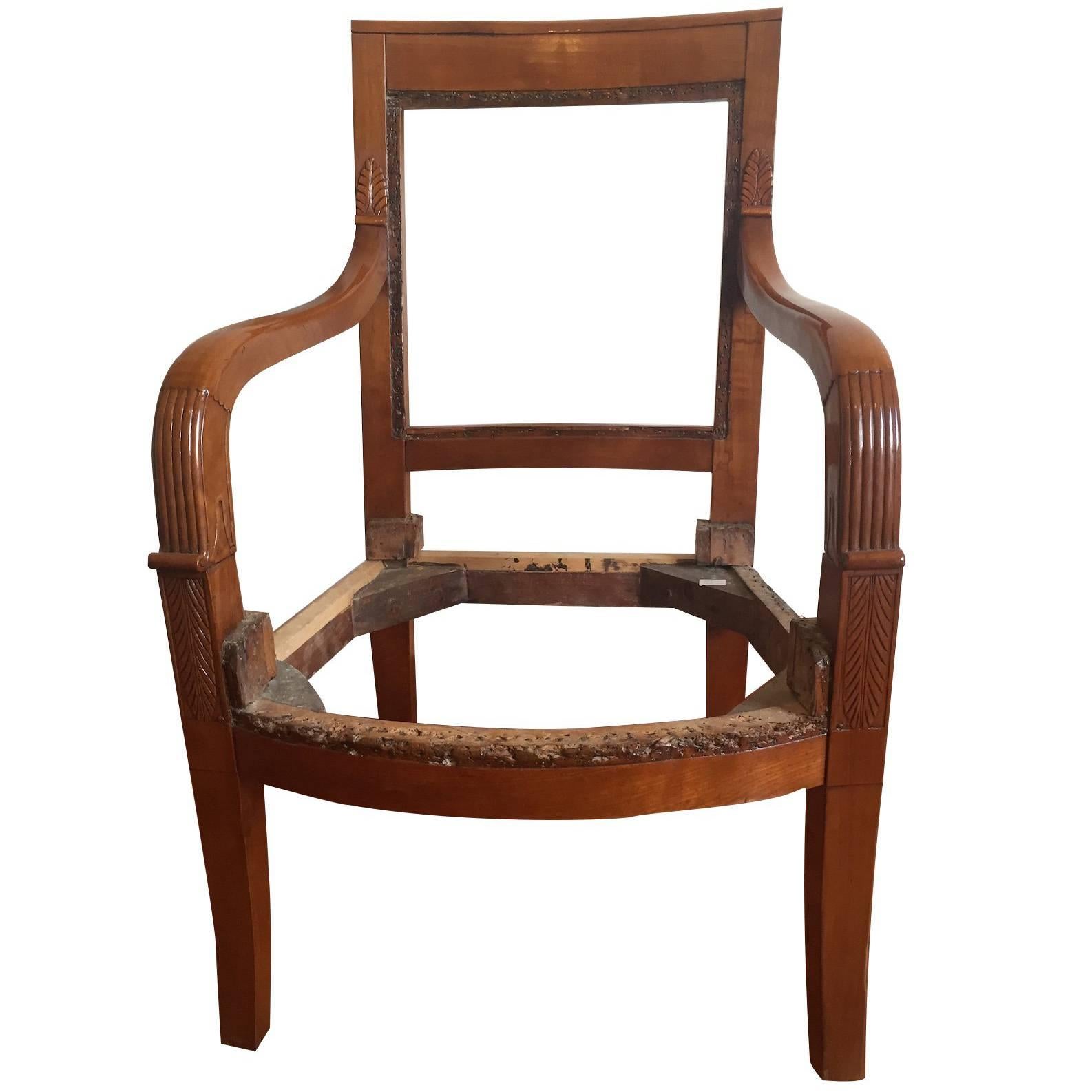 Fine quality French Empire cherrywood armchairs.
Carved arms in shallow relief with acanthus leaves, elegant saber legs, beautiful patina color.
To coat however you like.