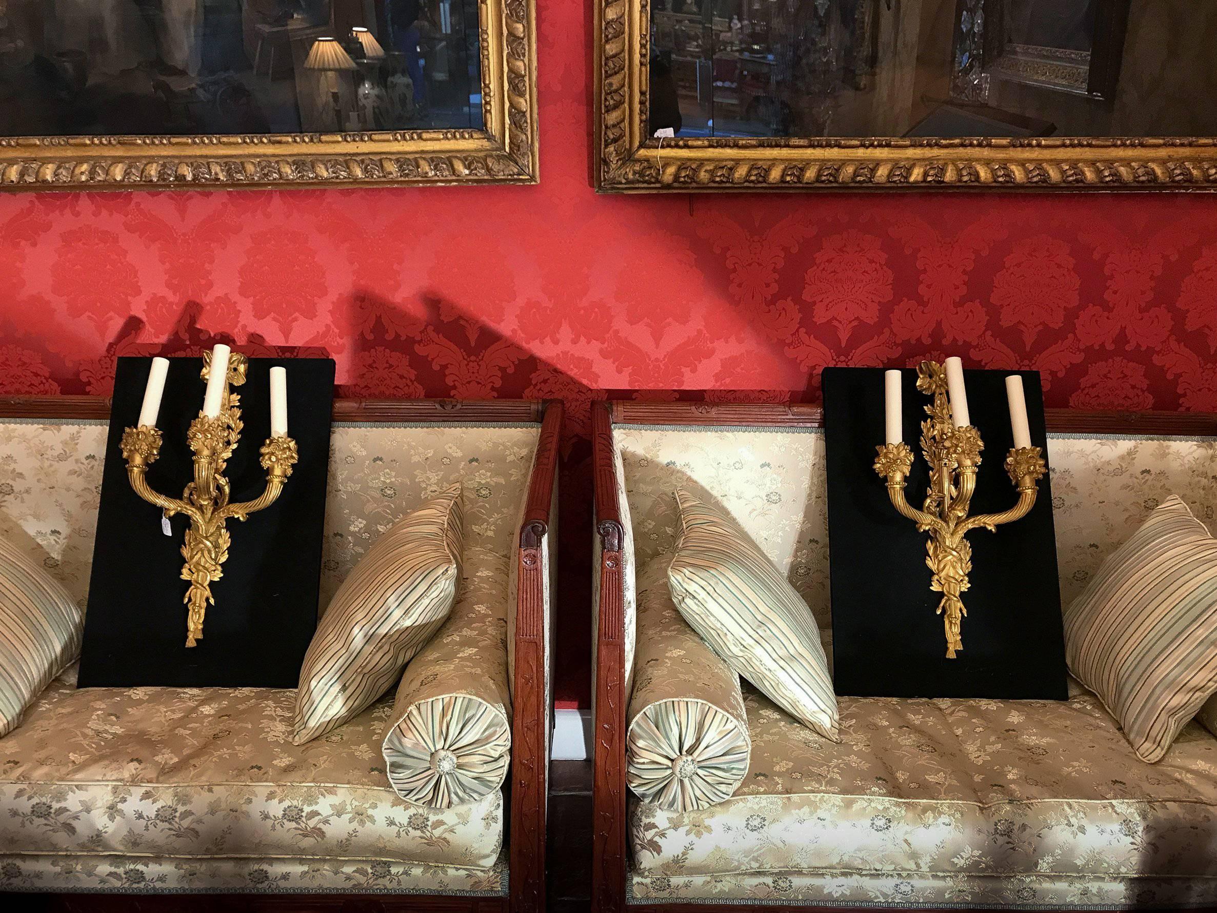 An amazing and very interesting pair of French Louis XVI style, three lights gilt-bronze sconces, chiseled of Cornucopia, flowers, and snakes.
Beautiful original gilding.

Our sconces are in perfect original condition. It has been professionally