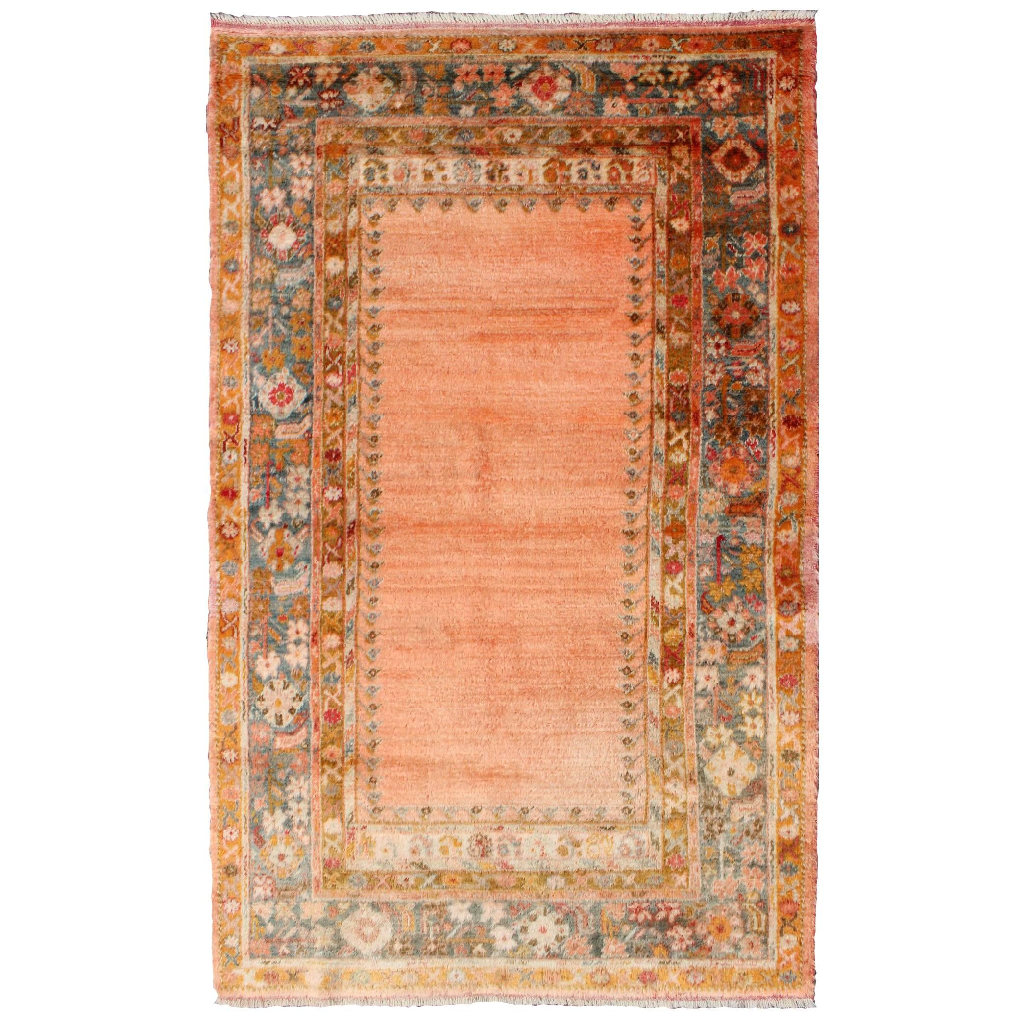 Antique Angora Wool Oushak Rug with Solid Salmon Field and Floral Borders For Sale