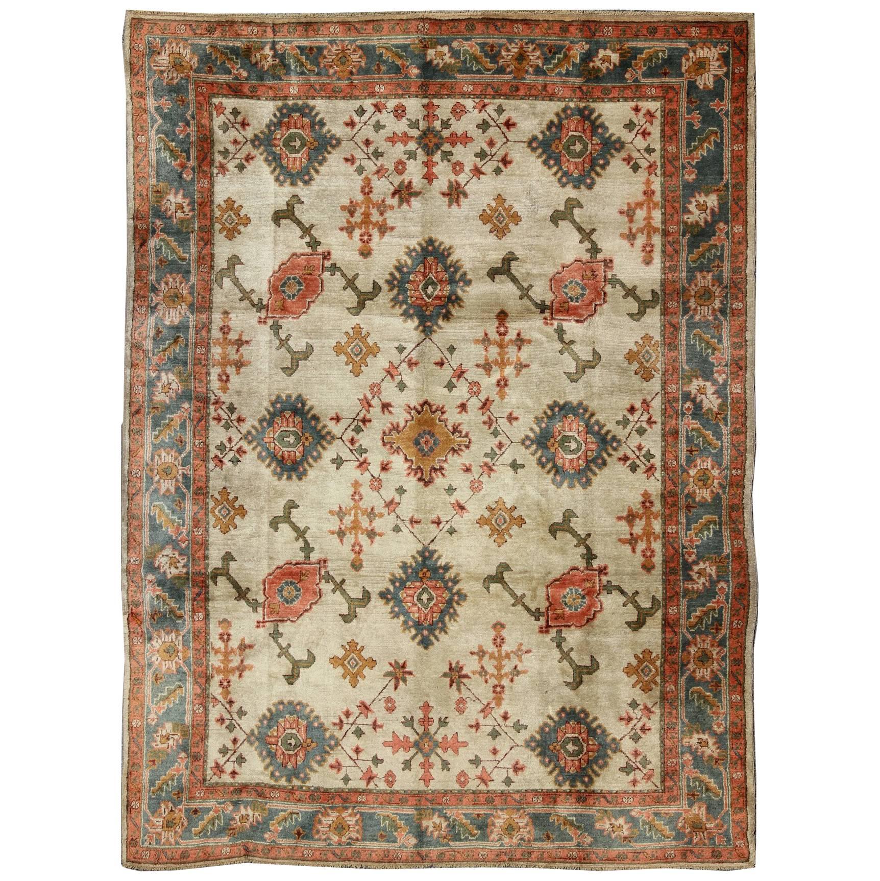 Antique Turkish Oushak Rug With All Over Design in Teal, Cream & Coral For Sale