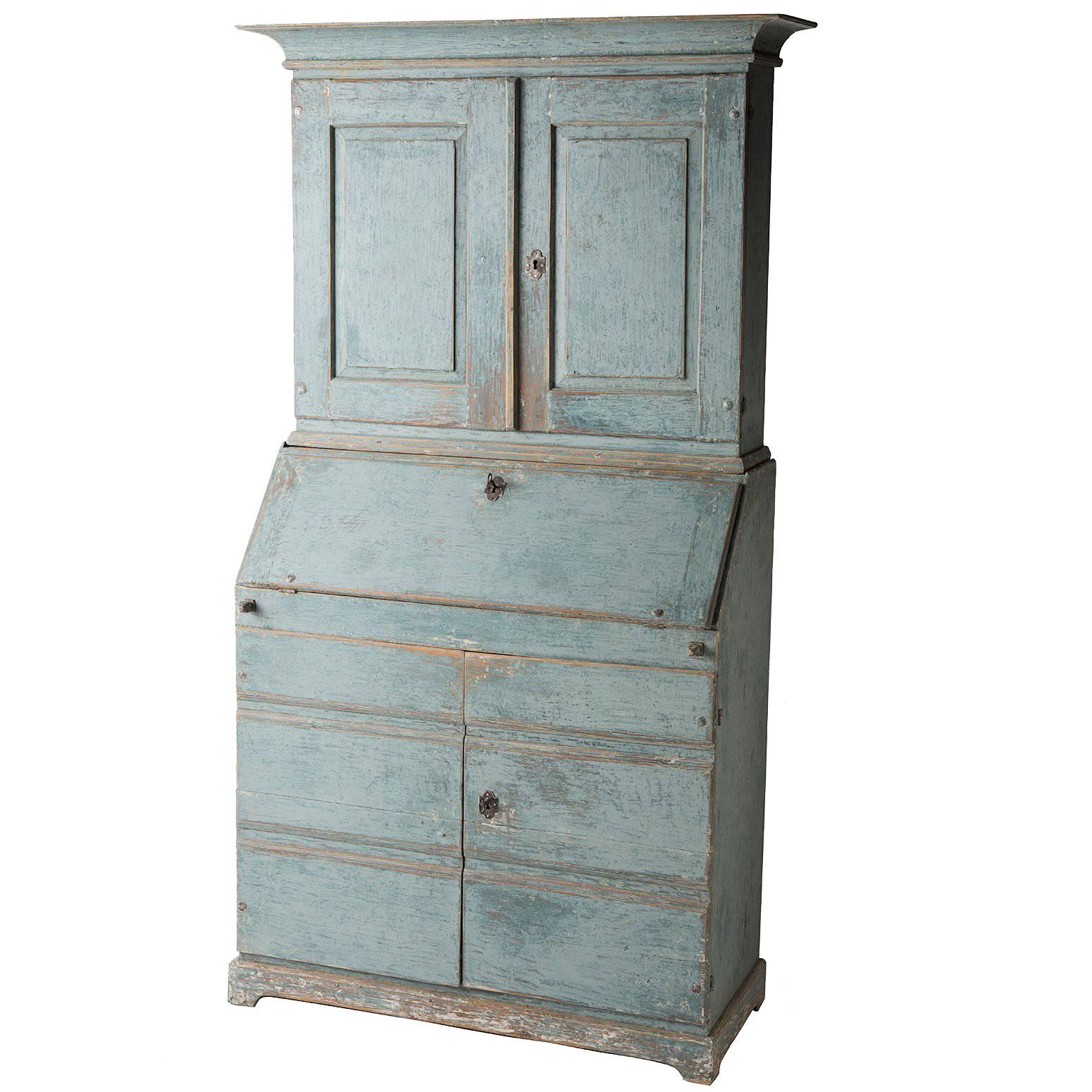 A wonderful Swedish blue, this stately secretary has a number of great details that highlight the work of a talented calligrapher. The interior drawers are beautifully numbered from one to six, a great way to stay organized in style! The inside of