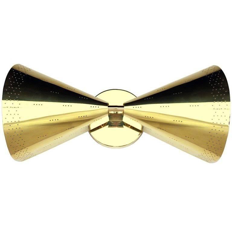 Bowtie sconce by Paavo Tynell Finland, 1950s
Brass good condition.
 