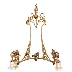 Antique French 19th Century Ormolu Four-Light Chandelier with Flying Cherub and Foliage