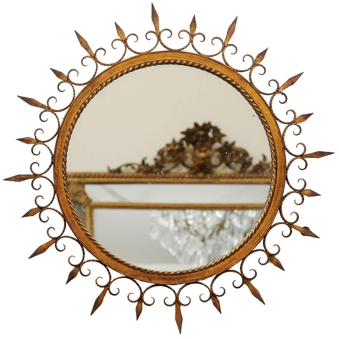 French Gilded Forged Iron Sunburst Mirror with Stylized Fleurs-de-Lys Motifs