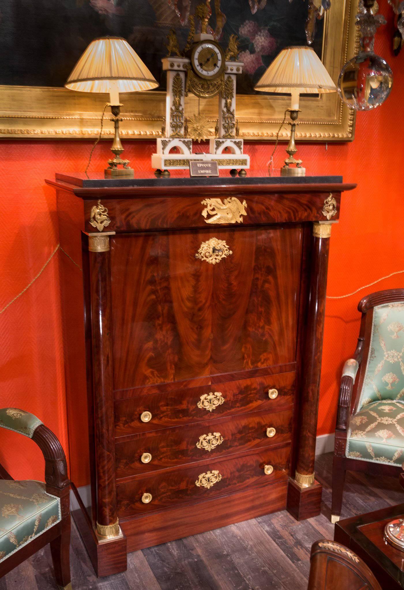 Early 19th century, French First Empire period, attributed to Jacob Freres Rue Meslée, flame mahogany, and gilt bronze-mounted “secretaire a abattant” with French polish retaining its original dark gray Belgium black marble top.

Decorated