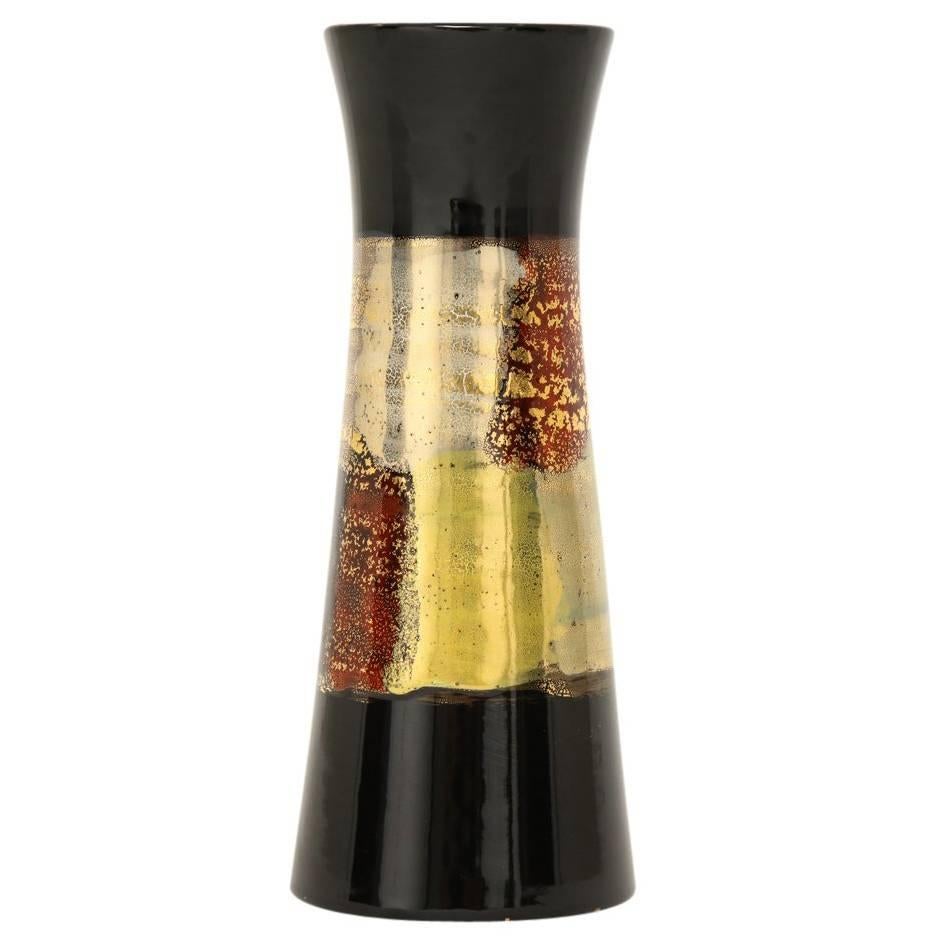 Bitossi vase, ceramic, Oro Rotto, metallic gold, black, signed. Small scale hour glass form vase from Bitossi's Oro Rotto (broken gold) series. The body is decorated with a glazed abstract patchwork pattern of metallic gold, dark red, and blue over