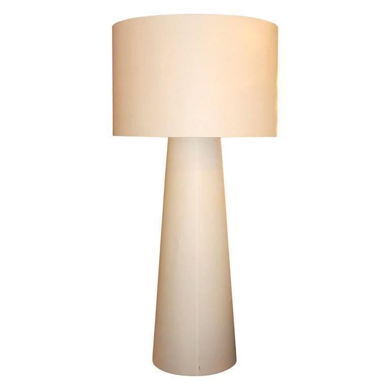 A very big scale floor lamp that really is all that. All white "Shadows" design provides very warm ambient glow. Great look. With its mushroom-like design, this beautiful large floor lamp is just what you need to fill that empty space in
