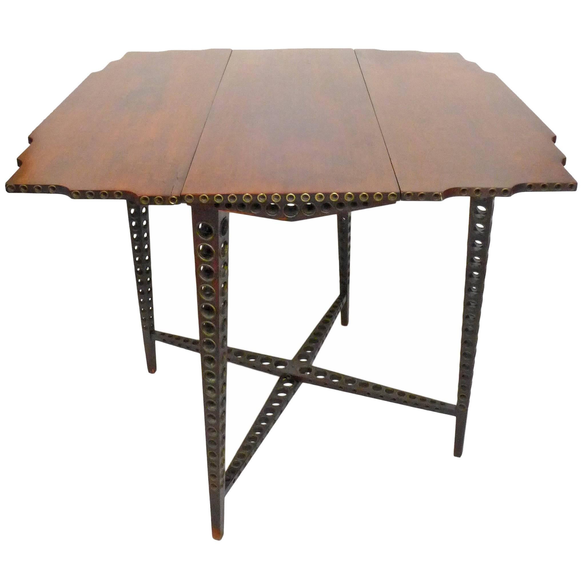 Early 20th Century Drop-Leaf Wood and Brass-Grommet Table For Sale