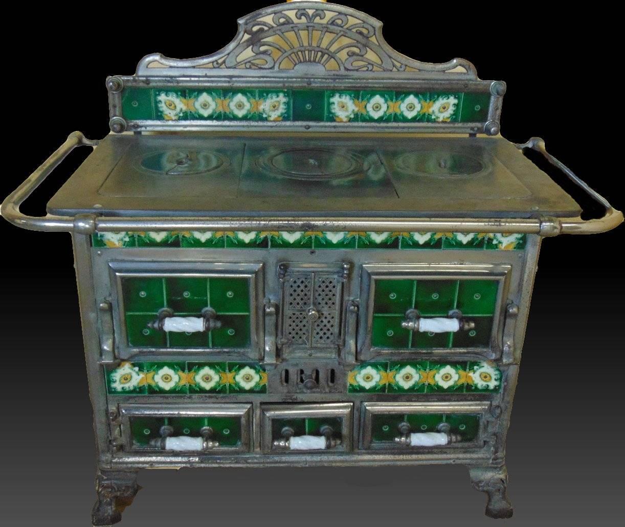 A stunning all original coal fired range cooker from France made by SDP Model No11. circa 1900 this highly decorative range retains its original coal scuttle. Both the range and the scuttle have 100% undamaged Faience tiles the metal work is also