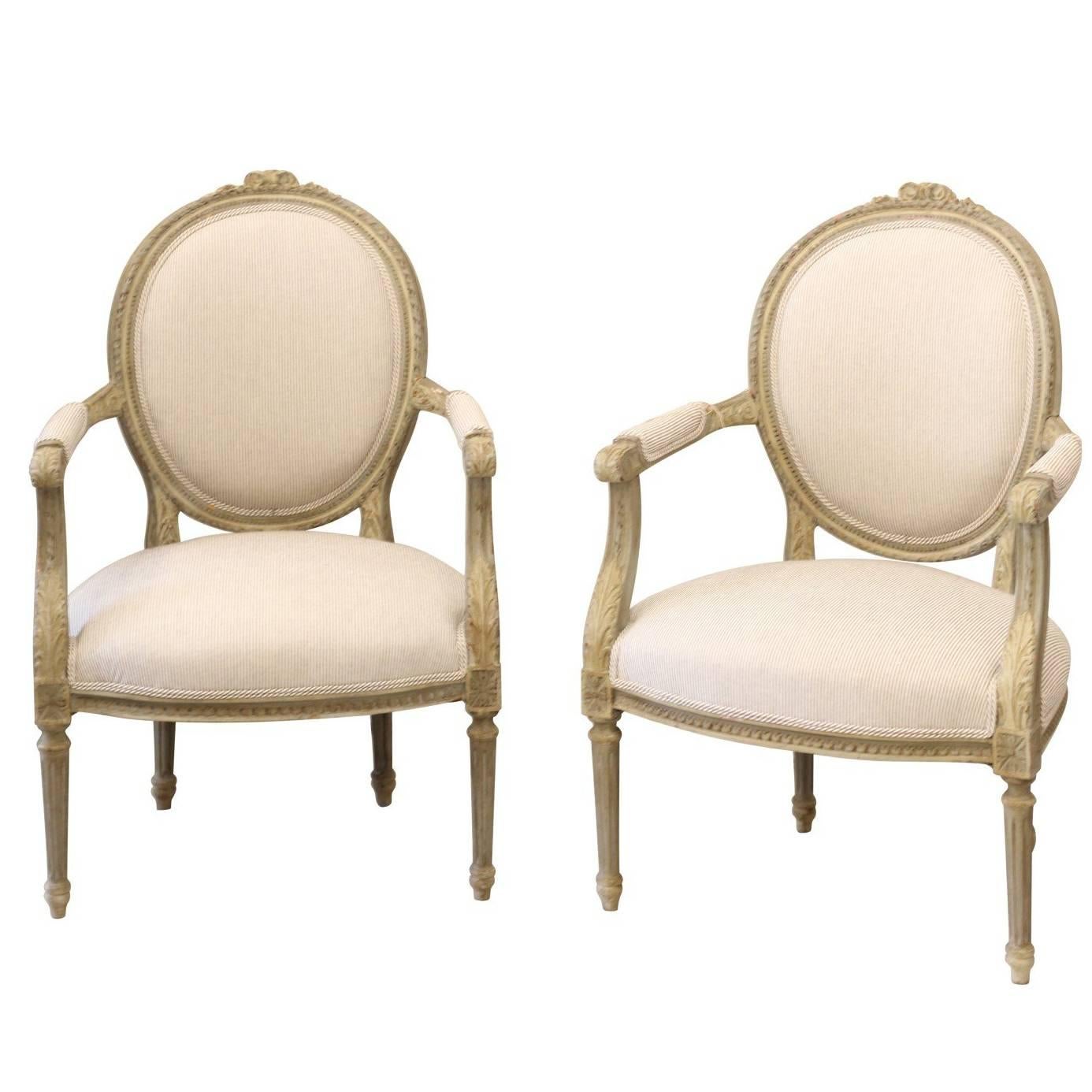 Pair of 1880s French Louis XVI Style Oval Back Painted and Carved Armchairs