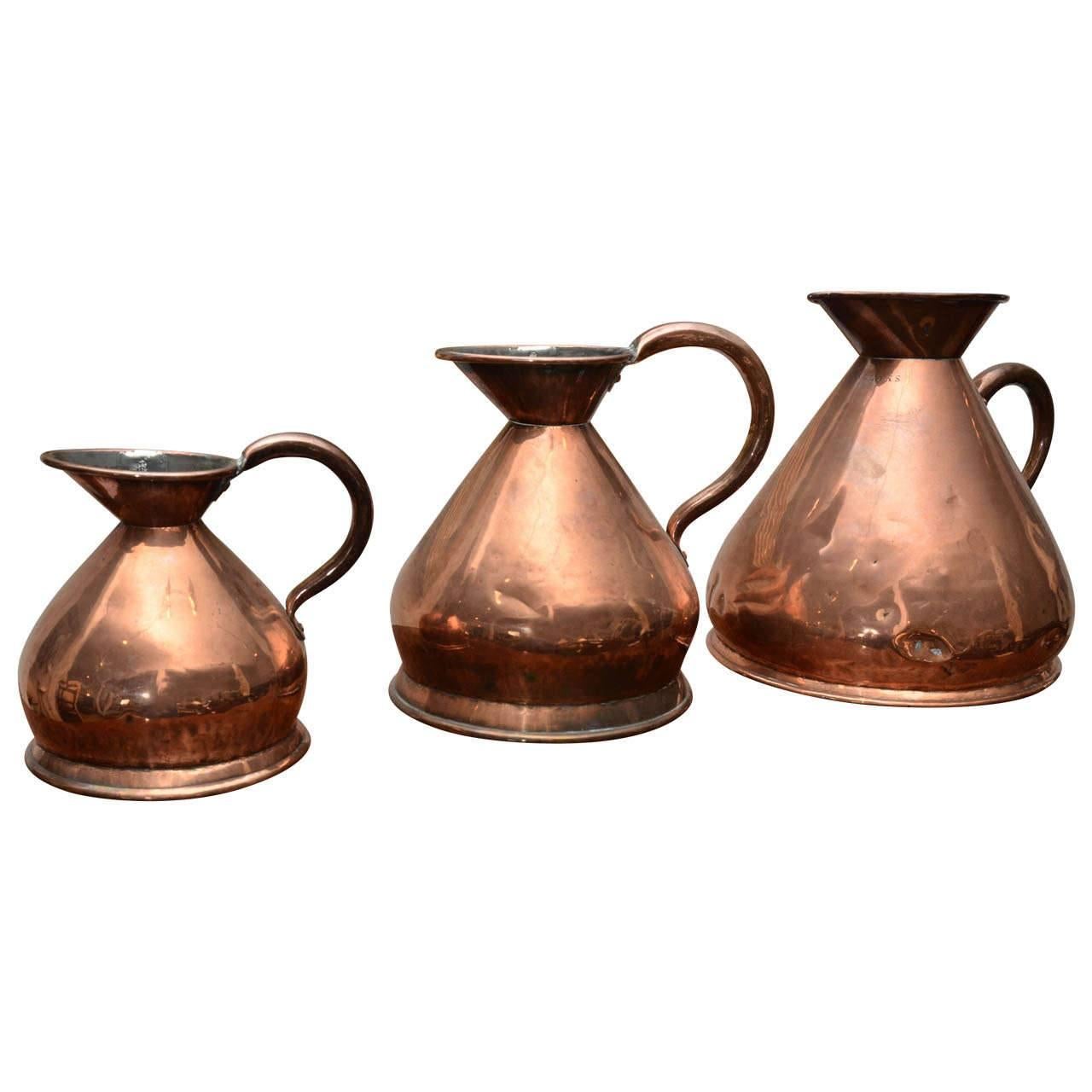 Matched Set of 19th Century Copper Pitchers 'Stamped' For Sale