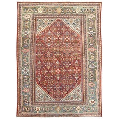 Antique Persian Sultanabad Rug in Terracotta Red Background and Green Border