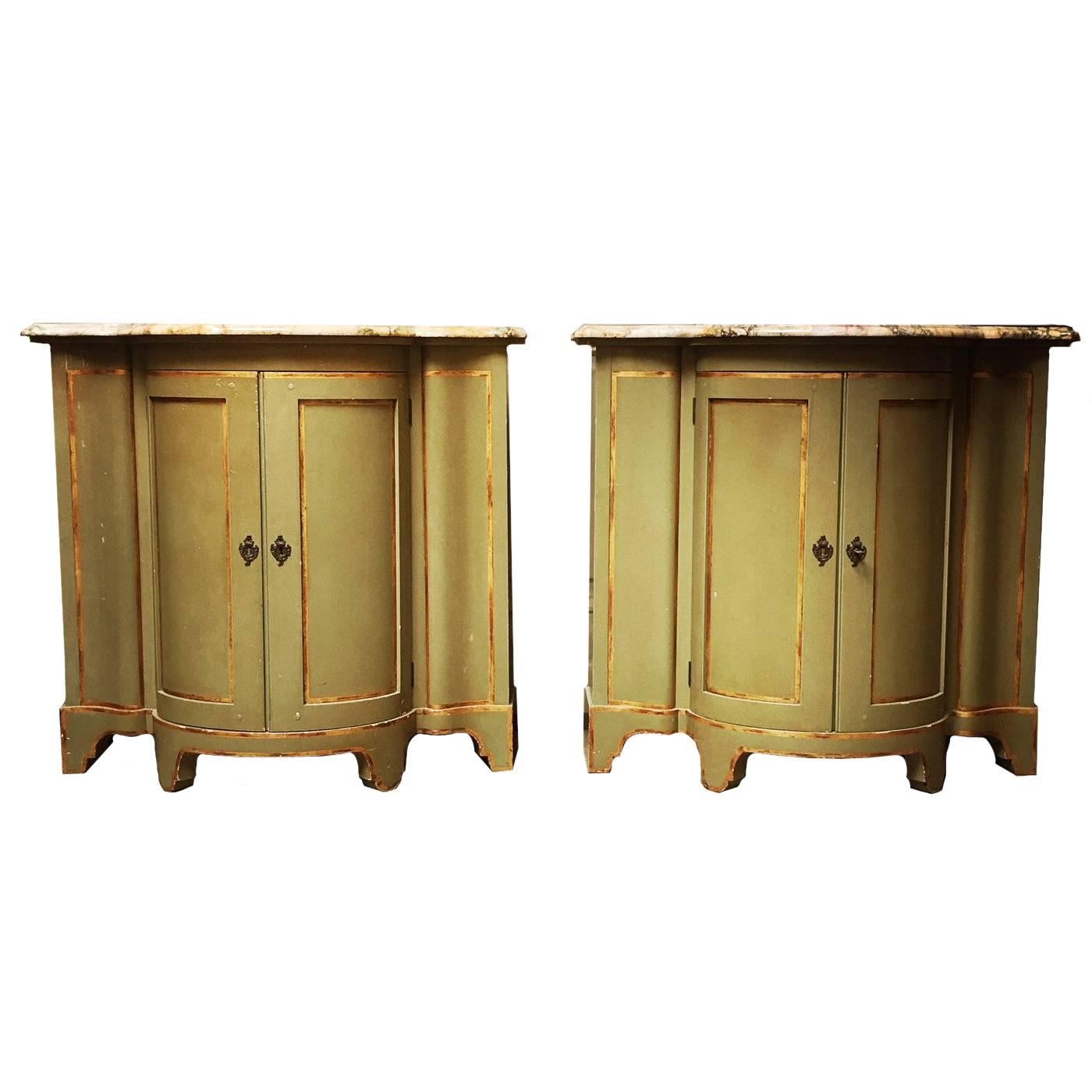 A Pair of Painted And Parcel Gilt Cabinets With Marble Tops