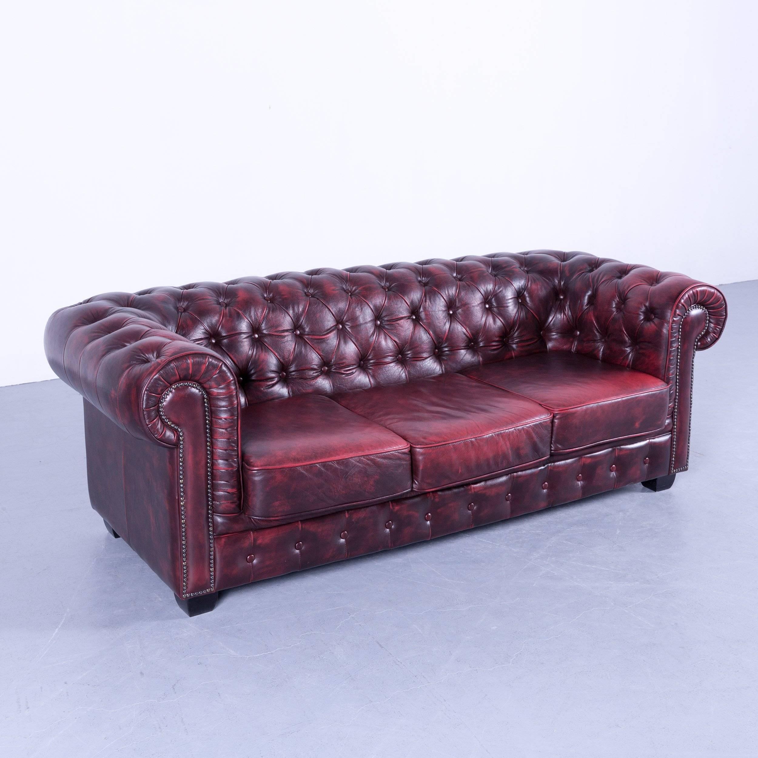 Chesterfield sofa oxblood red three-seat couch vintage retro handmade rivets.