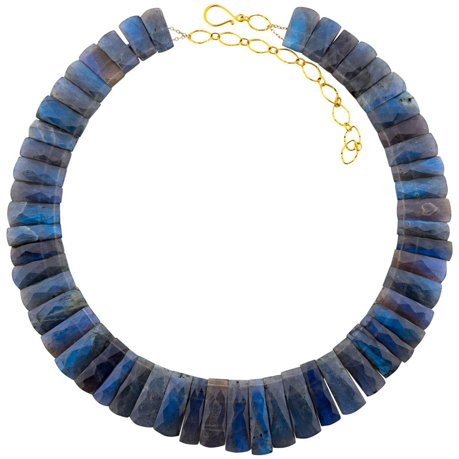 This beautiful Labradorite necklace is stunning and has a great weight to it. The iridescence of it captures the light is so many different angles that the blue tones absolutely glow! Very regal and very elegant!