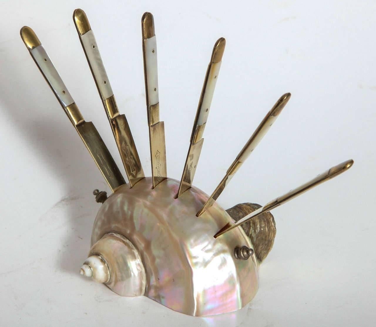Mother-of-pearl and Bronze Pate Knife Set on a Shell 1