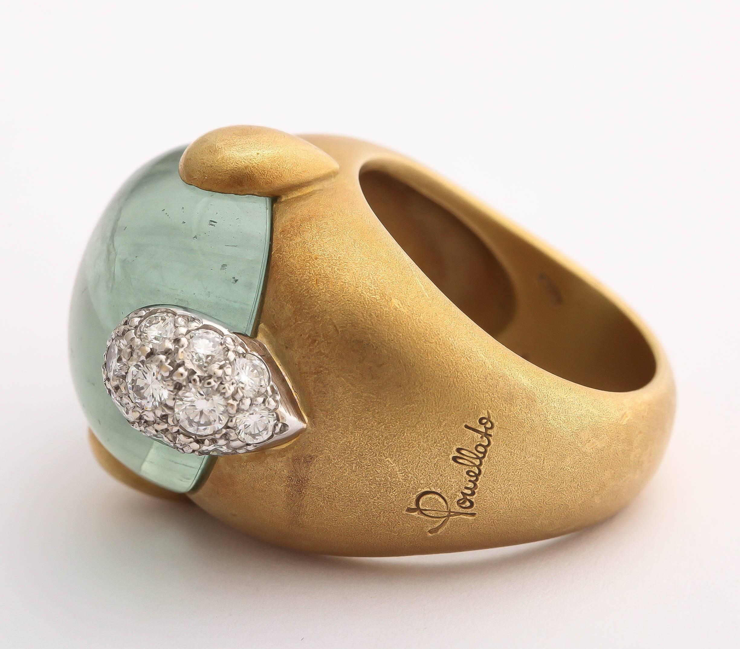 A fabulous significant satin 18kt gold ring with green aquamarine cabochon with diamond inclusion set in white gold. Signed by Pomellato