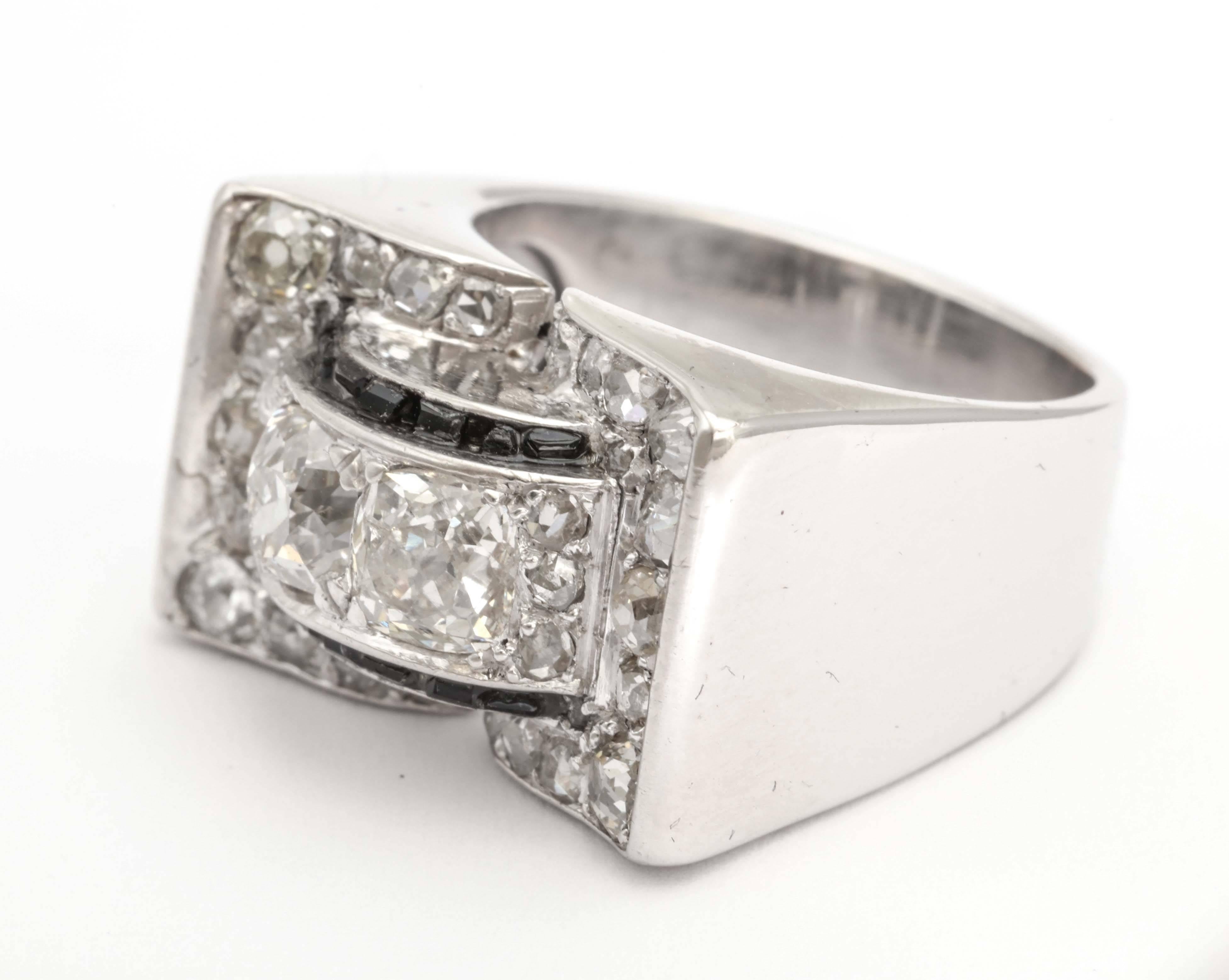A fabulous french retro diamond ring in white gold with onyx baguettes