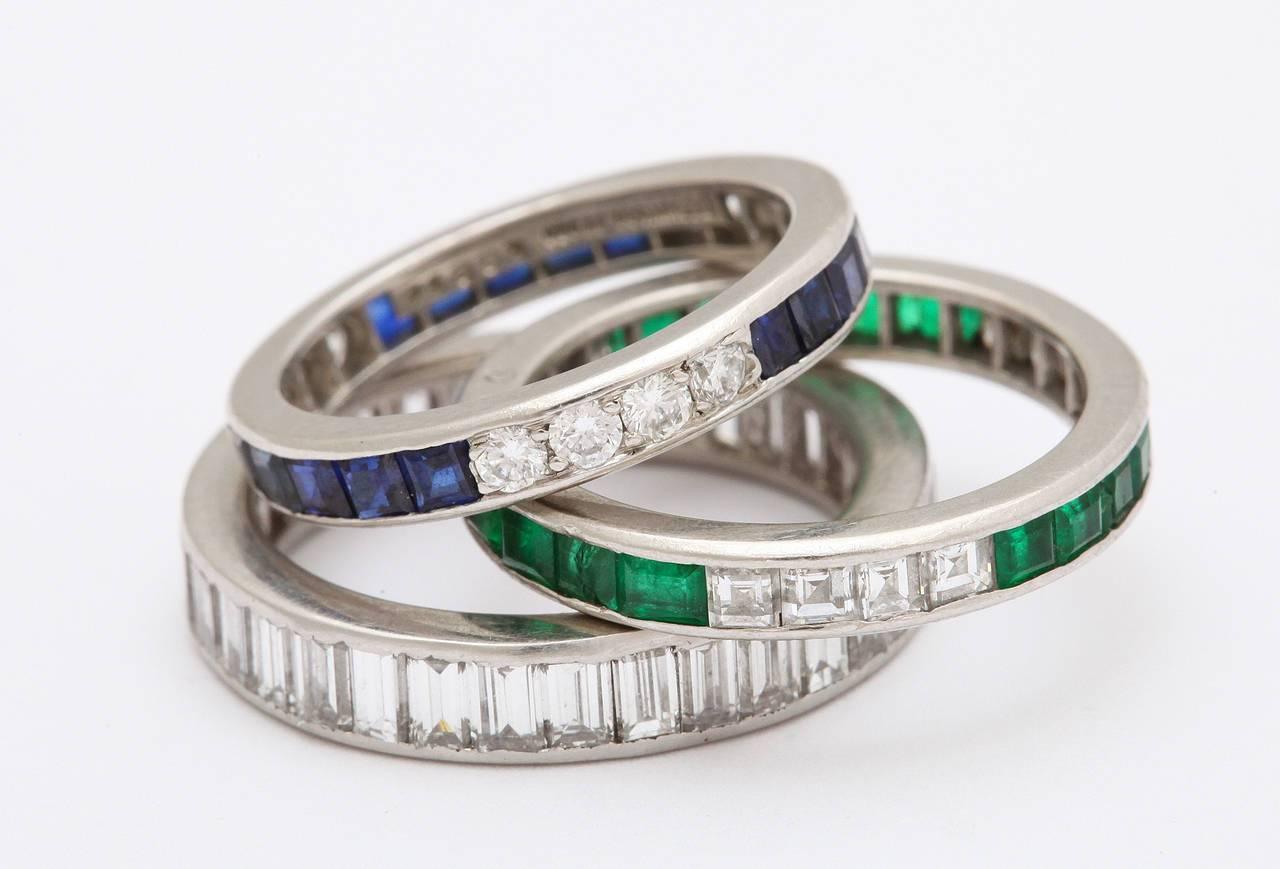 A fantastic selection of Art Deco eternity bands in various combinations of sapphires, diamonds and emeralds on a platinum ring. Prices for each range from $3000 to $7200.