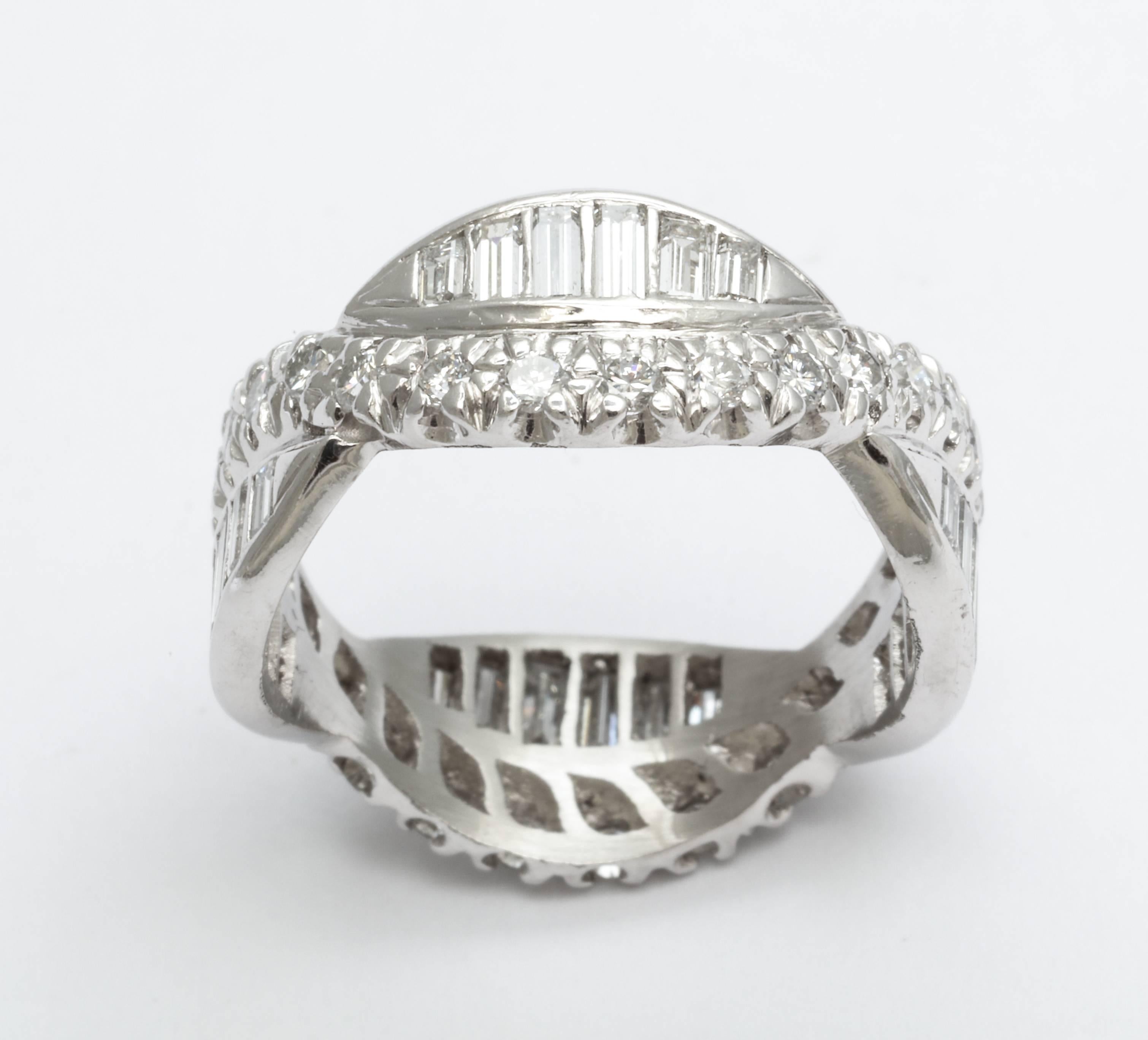 An elegant period Art Deco eternity band woven form with diamond baguettes and chips set in platinum. Measures: Its ring size is 5 3/4.