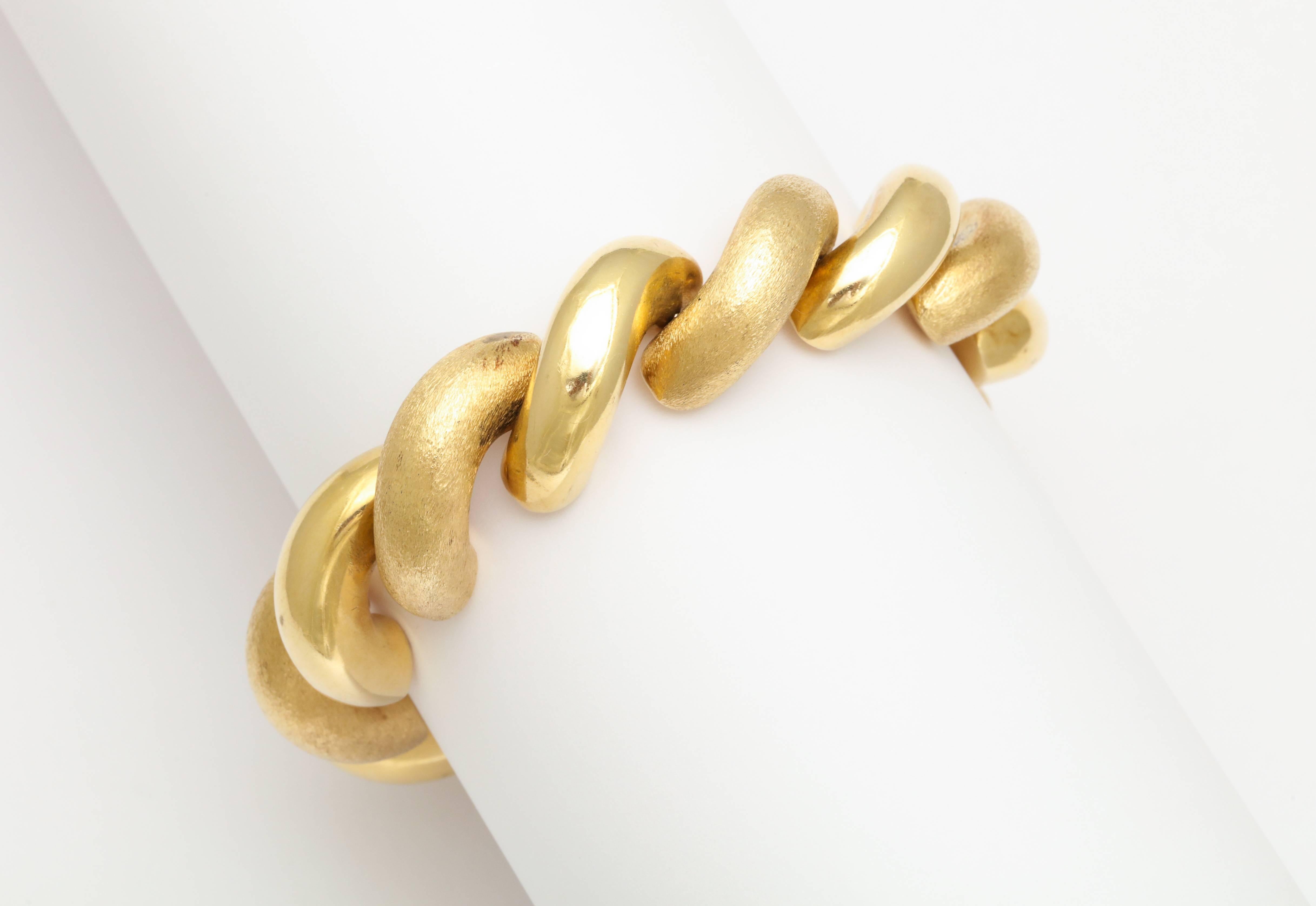 An elegant San Marco 14 kt two-tone brushed gold bracelet.