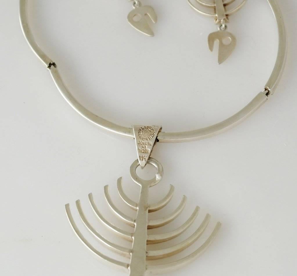 Being offered is a circa 1963 sterling silver necklace & pair of earrings by Los Castillo of Taxco, Mexico.
