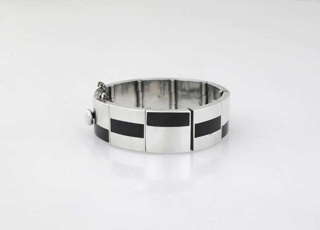 Being offered is a circa 1960s silver and onyx bracelet by Antonio Pineda of Taxco, Mexico.

Stanley Szaro Antonio Pineda Collection
