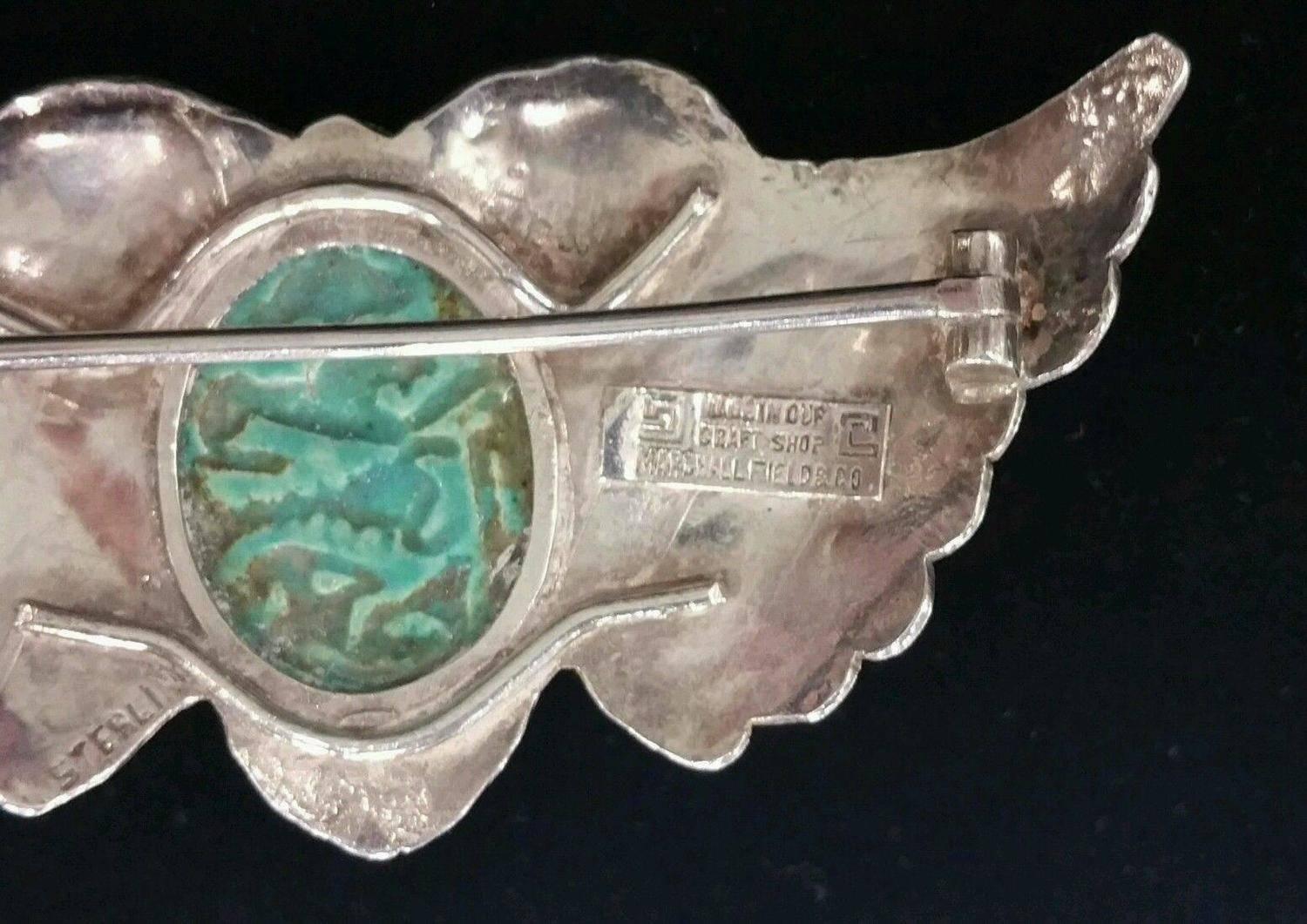 Being offered is an exceedingly rare circa 1915 sterling silver pin by Marshall Field of Chicago, Illinois. Incredible pin comprising a handwrought winged design; at the center, an intricately carved scarab. Dimensions : 3 1/4 inches x 1 3/4 inches.
