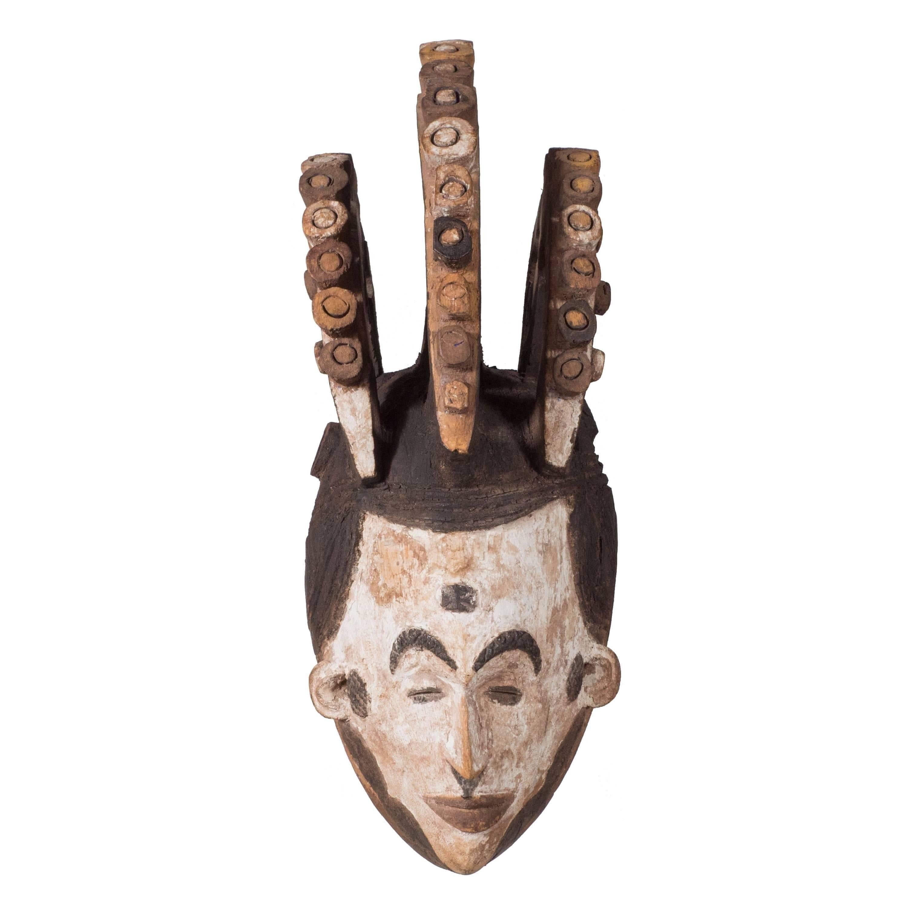 Unknown Abstract Sculpture - Wall-Mounted Carved Wood Sculpture of Igbo Mask Nigeria, Late 19th Century