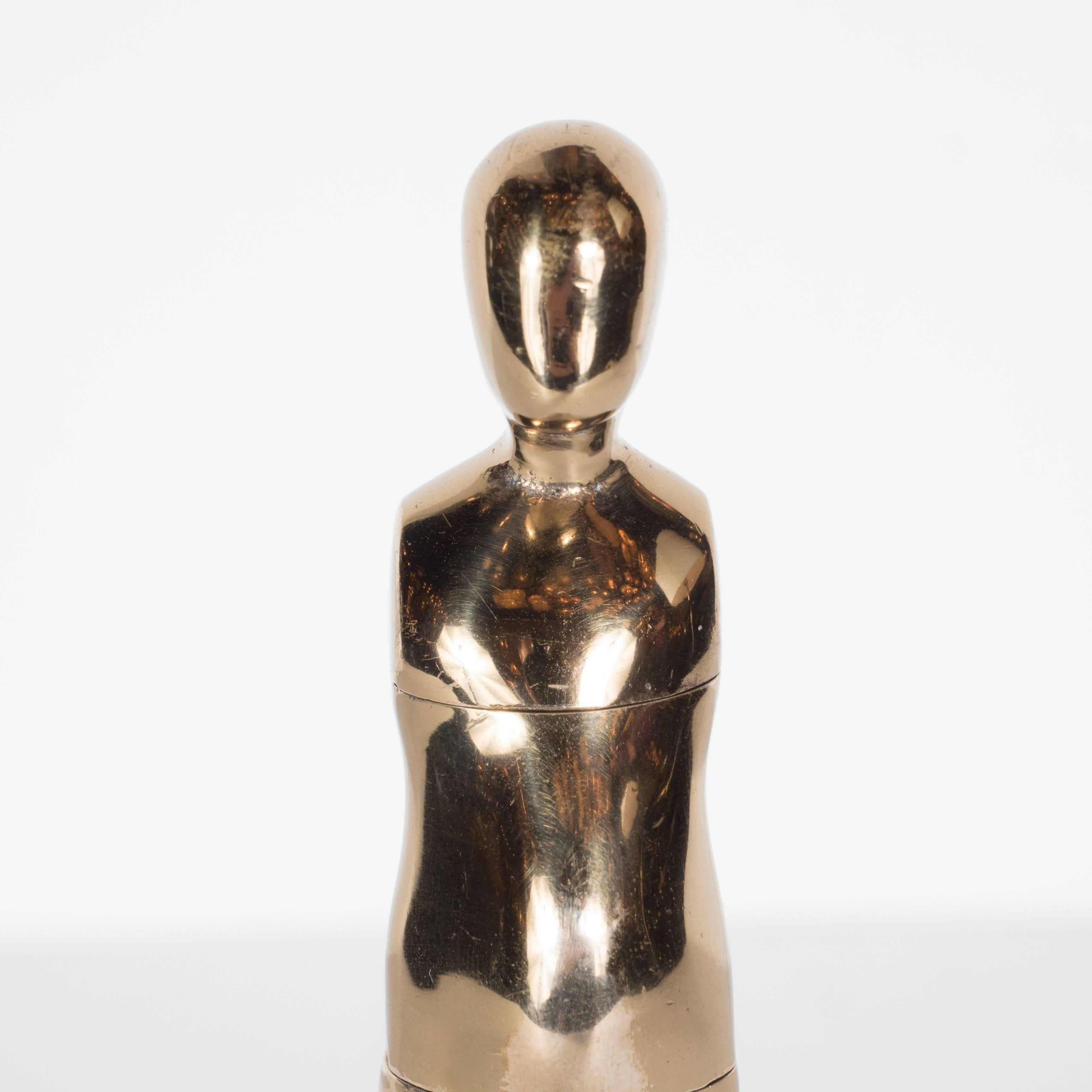 This compelling sculpture, executed in brass circa 1960, represents a study for Ernest Tino Trova's most iconic body of work, 