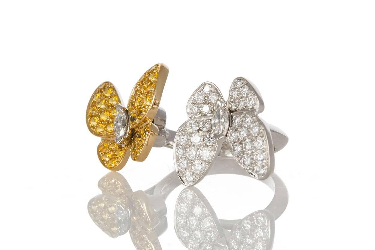 We are pleased to offer these beautiful Guaranteed Authentic Van Cleef & Arpels 18k Gold, Diamond & Sapphire Two Butterfly Between the Finger ring. Van Cleef & Arpels revisits one of its most treasured themes in the Two Butterfly jewelry collection.