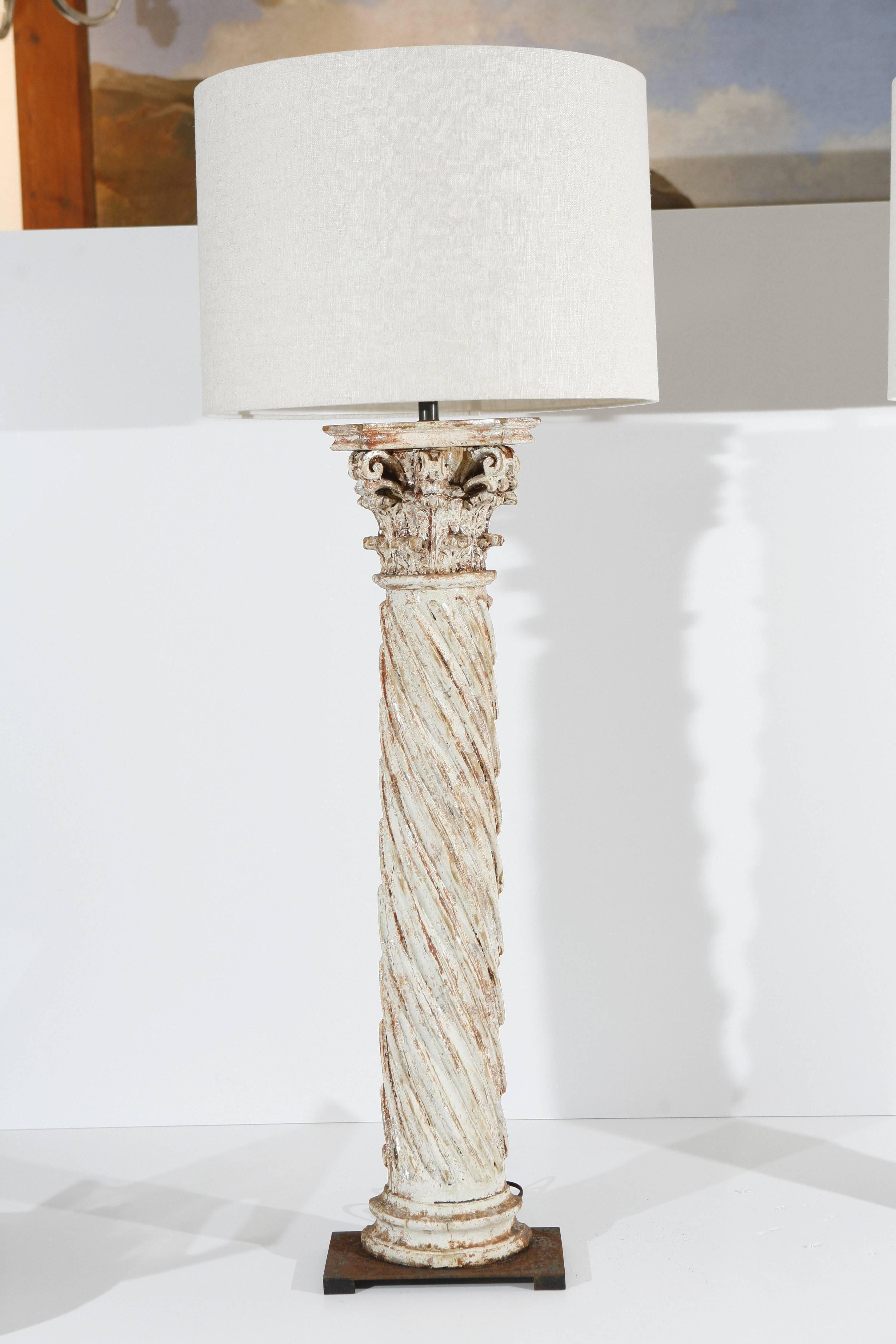 These are a very nice pair of antique hand-painted twist column Lamps.
They sit on a square metal platform base.
The paintwork is original in a off-white colors with some hint of red and silver.
These are all ready to use with the brass light