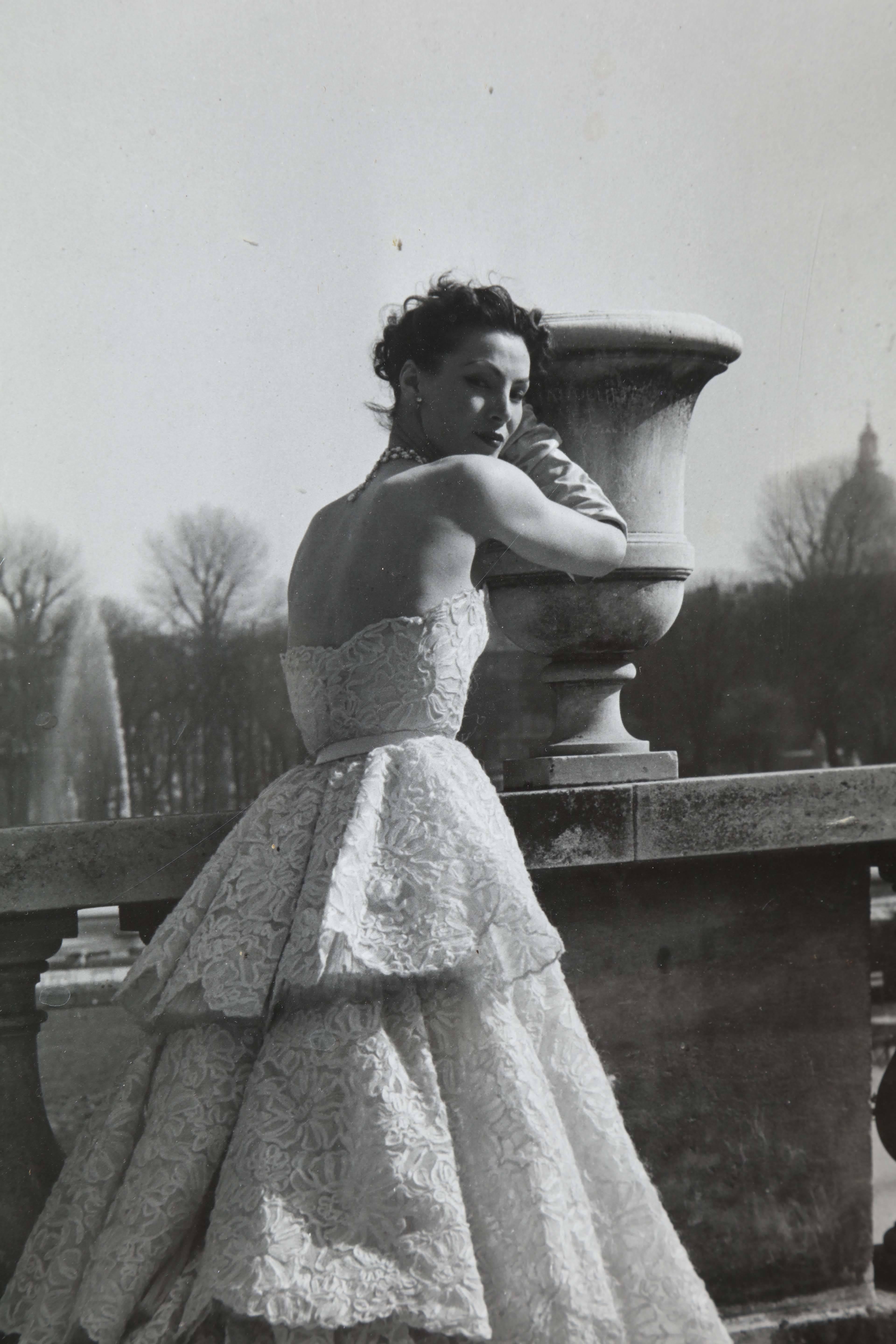 Depicting a Dior evening gown worn by Lucky, Dior's favorite model. In a 19th century gilt frame.  Dimensions listed are framed.

Willy Maywald (German, 1907–1985) emigrated to Paris upon completing art school. After spending war time in a camp