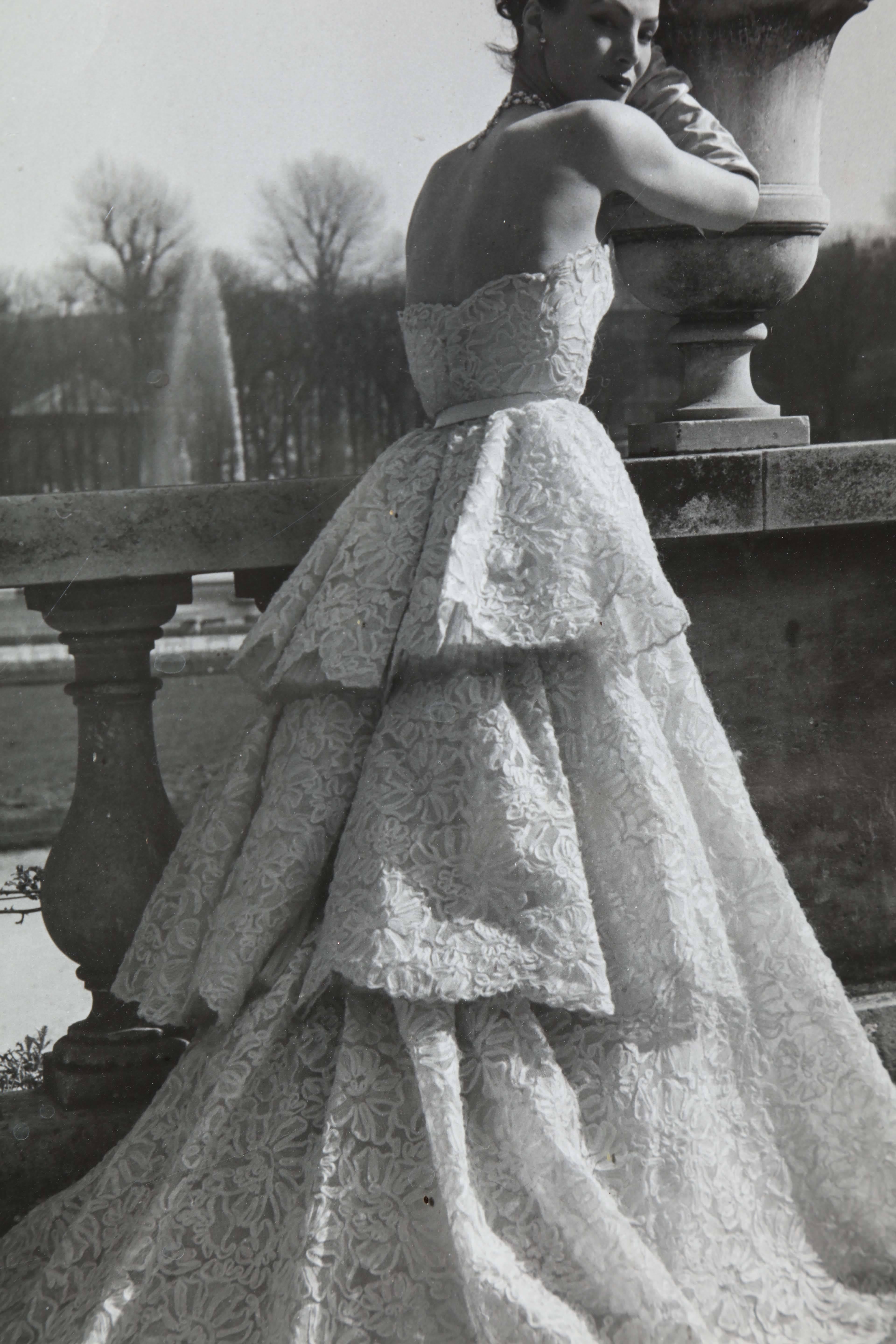 Lucky wearing a Dior evening gown - Gray Black and White Photograph by Willy Maywald