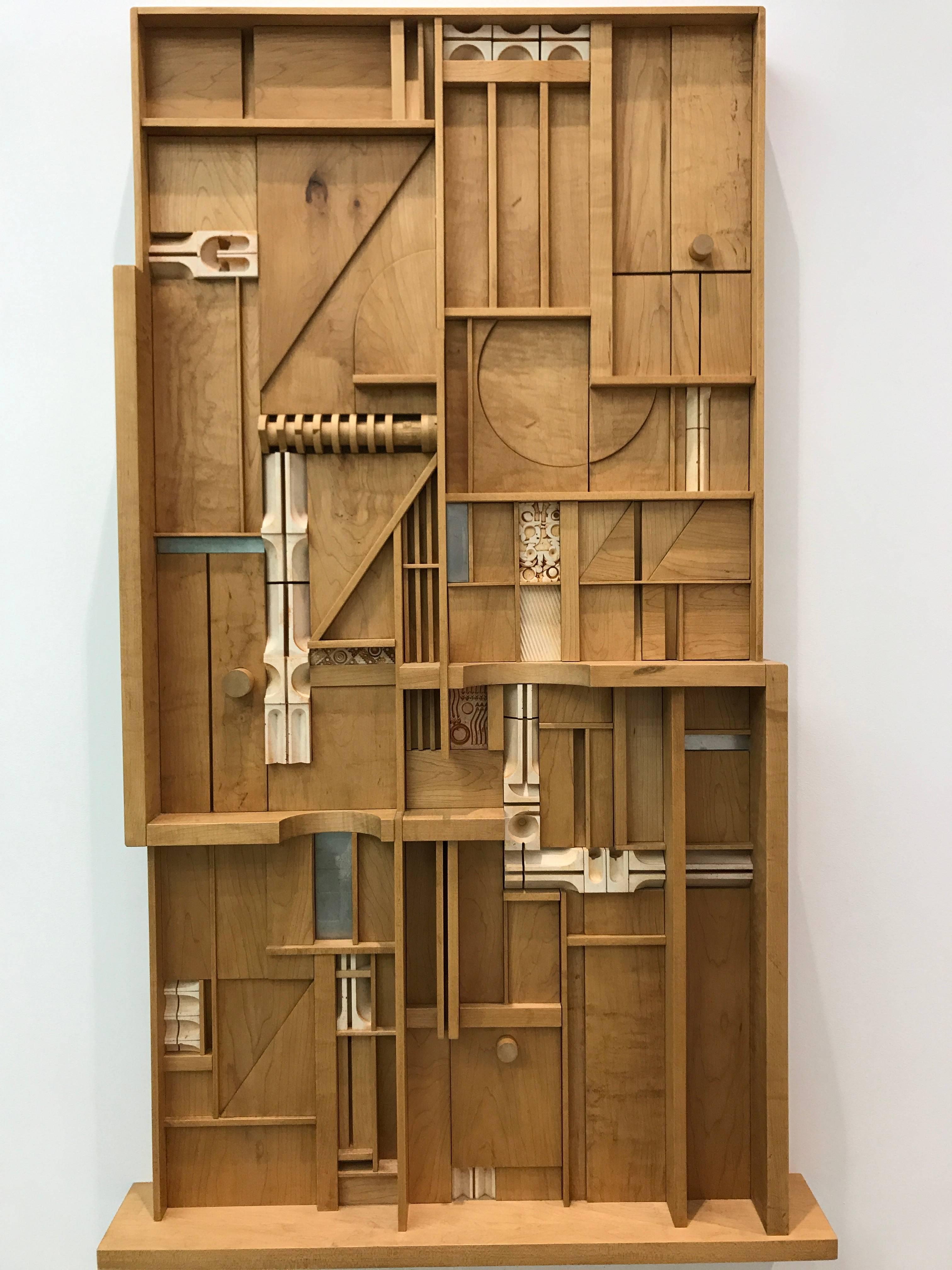 Mid-century modern art and design. This wood assemblage is composed of wood, metal, polyester resin that the artist reassembled into a new composition. 

The artist sourced the wood directly from a lumberyard, and it's a hard rock maple wood that