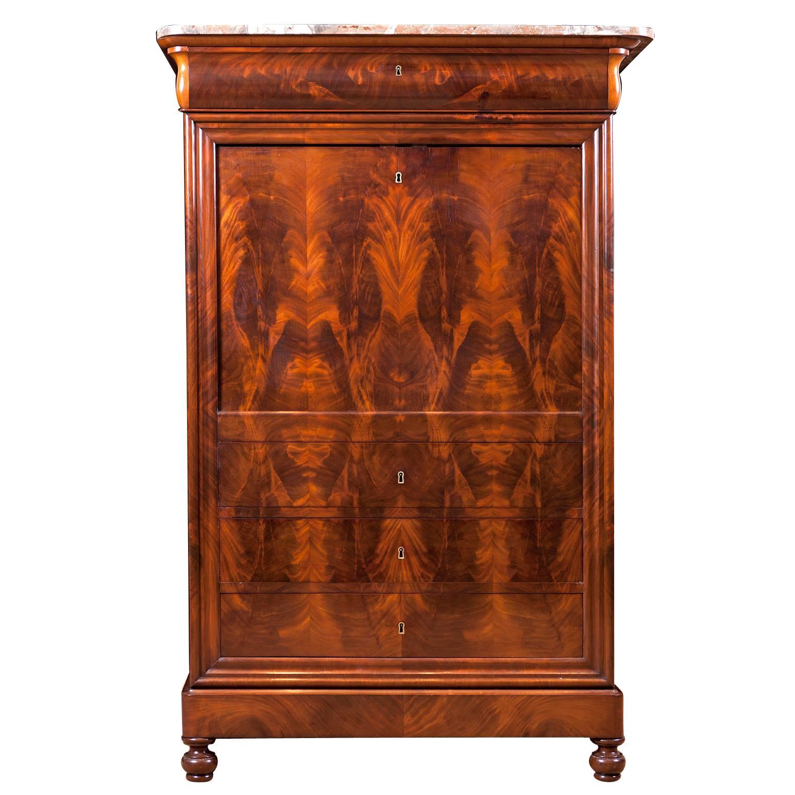 French Louis Philippe fall front secretary in mahogany with original marble top and bird's-eye maple interior, circa 1835. Beautiful crotch mahogany center matched pattern from the bottom drawer to the top of fall front.

Measures: 41 1/2