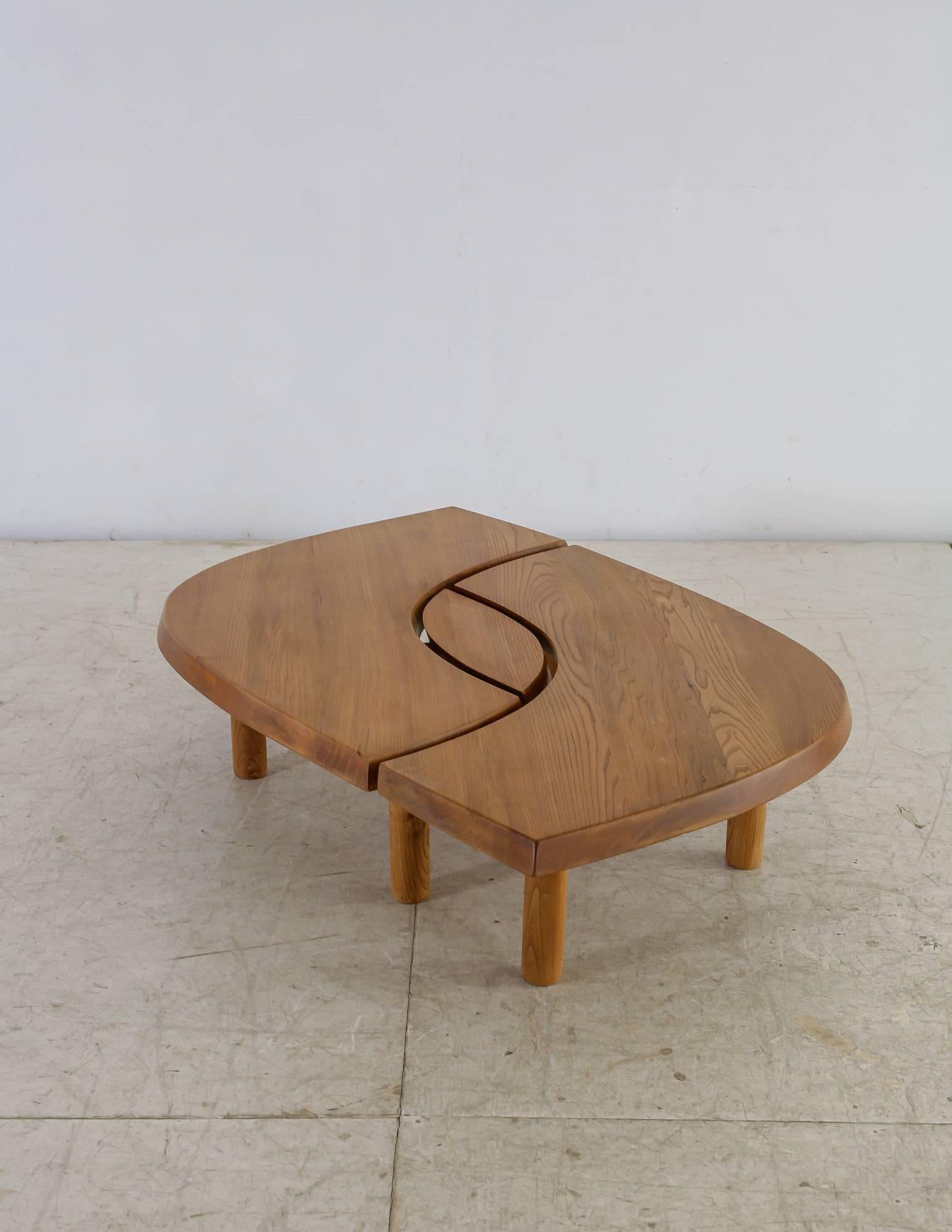 A model T22, or L'Oeuil ('eye'), coffee table in Elm by Pierre Chapo. This piece can be used as either one large table, or as two boomerang shaped tables and one small almond shaped table.
The table is beautifully darkened from age.