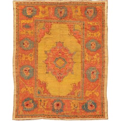 Antique Turkish Oushak Rug in  Saturated Gold, Orange Colors and Blue Accent 