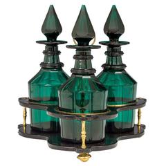 Set of Three Green Glass Victorian Decanters in Black Lacquer Stand