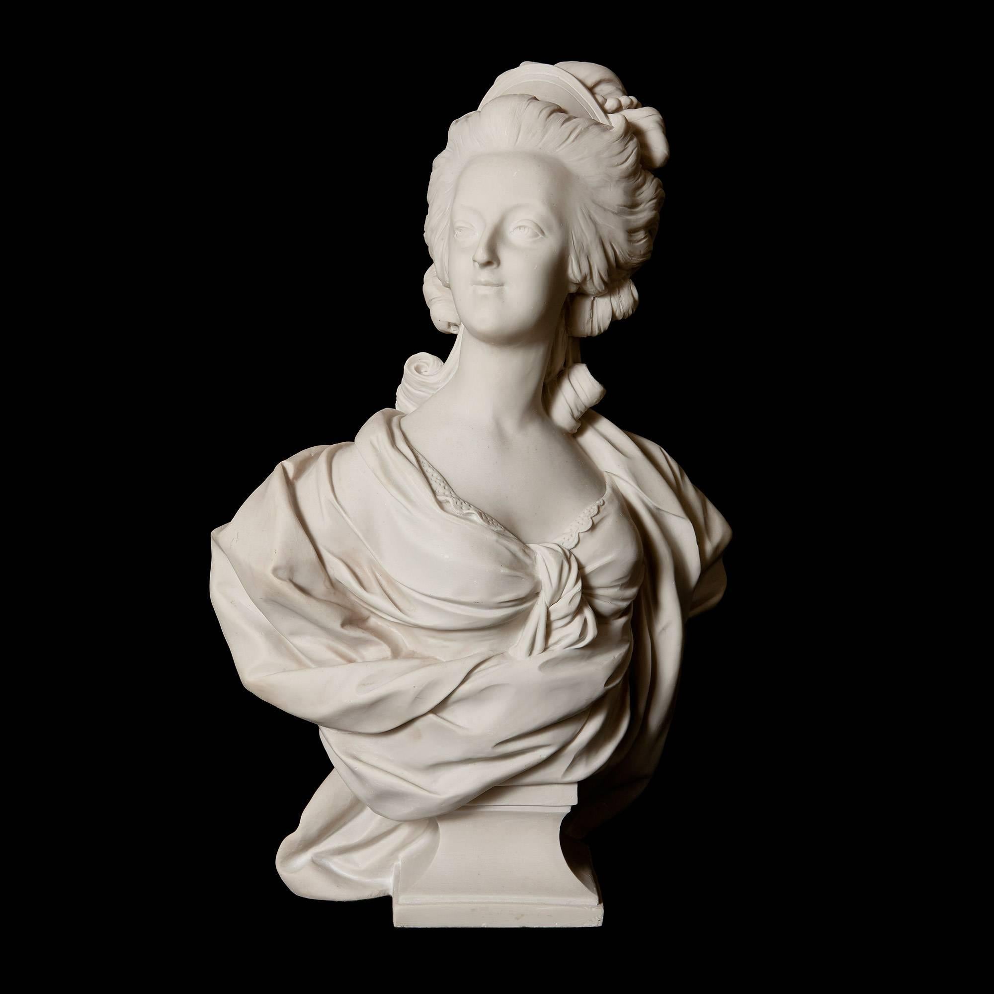 The figure dressed in period clothing and resting on a square plinth.

This charming marble bust perfectly illustrates the regal elegance that Marie Antoinette was famous for, as the queen appears supremely serene.