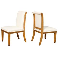 A Set of 12 Oak Dining-chairs with Leather Upholstery