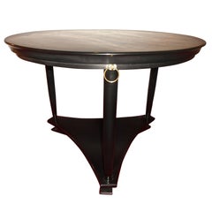 A Neo Classical Black Lacquer Center Table with Brass rings
