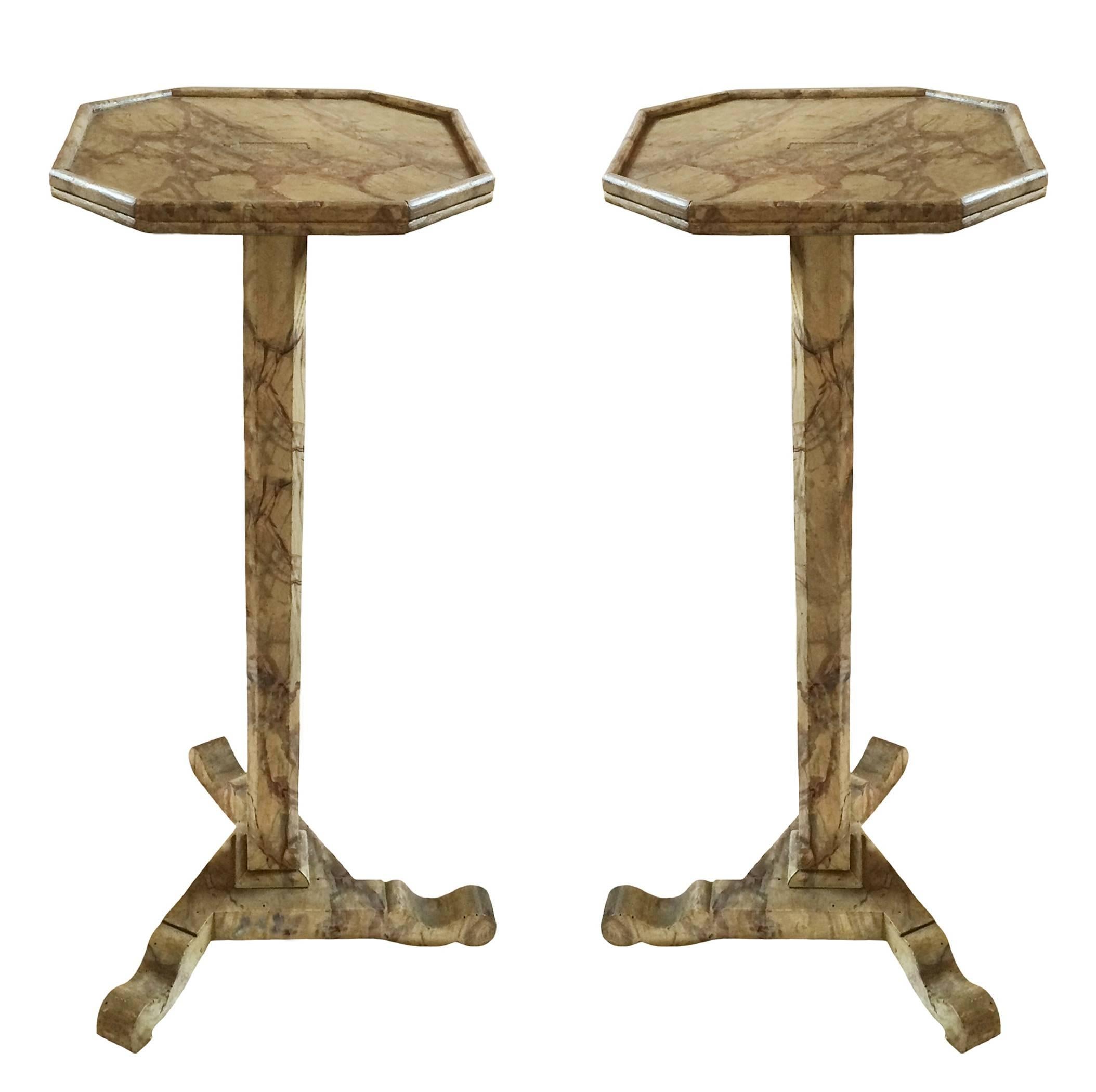 Pair of Italian marbleized octagonal wood pedestal stands; shaped tripartite base, 19th century. Sold as a pair.